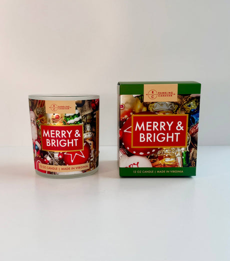 The 12oz Merry & Bright Candle is shown in a glass jar beside its festive green and red box, making it the perfect premium holiday scented candle for your celebrations.