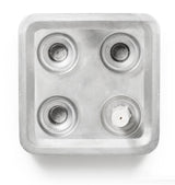 A top-down view of the Stumpastaken Fyran Four Candle Holder—square, in white powder-coated 100% recycled material—shows clean lines and practical Swedish design.