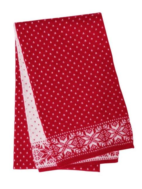 The Norlender Knitwear - Snowflake Red & White scarf features a red knitted design adorned with white snowflake patterns and polka dots, crafted from pure wool. Its style beautifully captures the essence of traditional Norwegian knitwear.