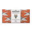 A chocolate bar with an orange wrapper covered in illustrated crocodile heads and a geometric animal logo; labeled Candy: OmNom Nicaragua 73% Dark Chocolate Made from Nicaraguan Cocoa Beans, 60g.