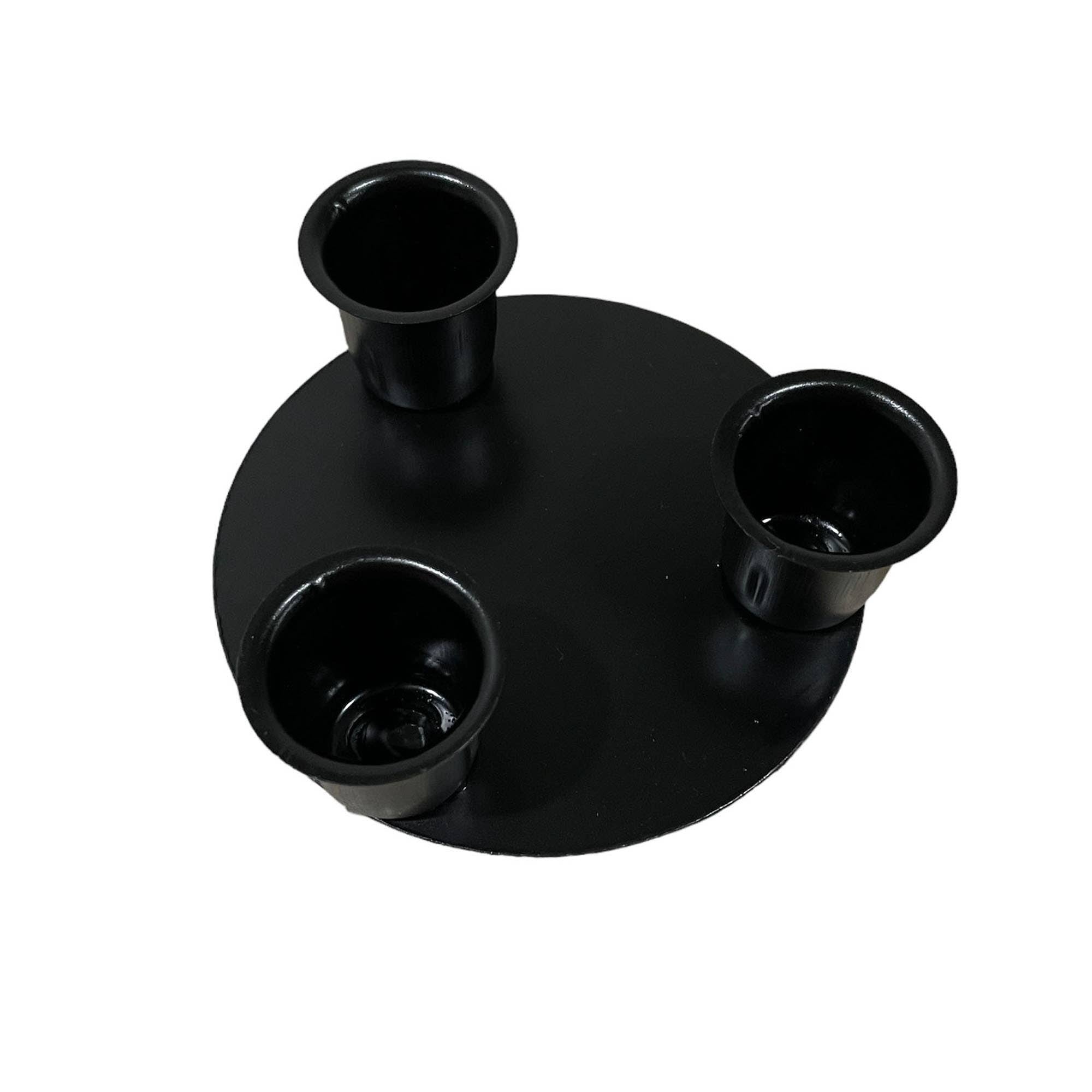 The Round Triple Wrought Iron Taper Holder, featuring a black circular base with three cylindrical holders, is a centerpiece candle holder that captures the timeless craftsmanship of Lancaster blacksmith products.