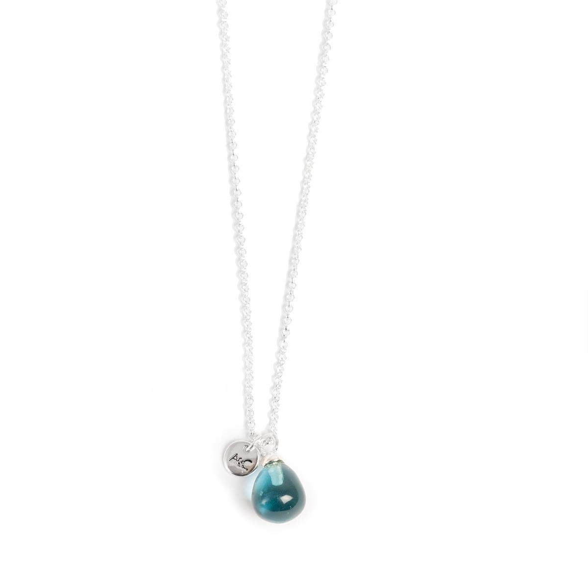 A&C Oslo Blue Pendant Silver Necklace with a teardrop pendant and a round tag etched with A.