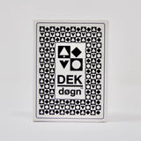 The DEK Døgn playing cards from Norway feature a unique aesthetic with geometric black designs set against a white background, highlighting Norwegian craftsmanship.