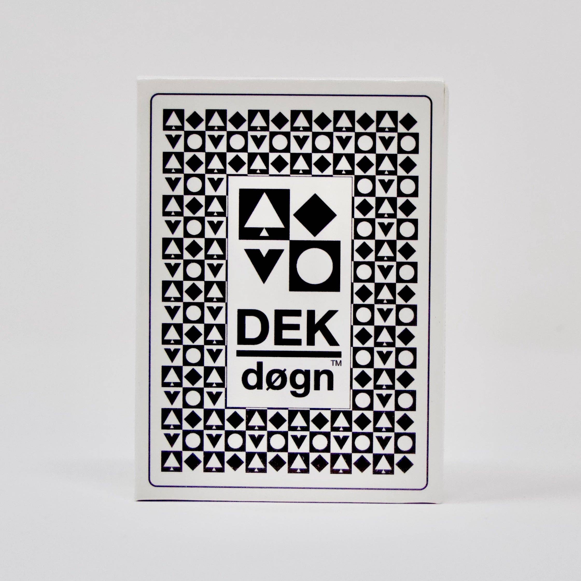 The DEK Døgn playing cards from Norway feature a unique aesthetic with geometric black designs set against a white background, highlighting Norwegian craftsmanship.