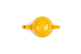 The Tea Pot: Yellow Earthenware Teapot 37-Ounce features a stay-cool handle and is shown from above on a white background.