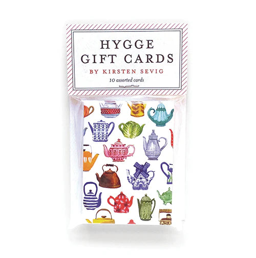 Explore the 10-pack of Hygge Gift Cards, featuring vibrant illustrated teapots and hand-painted designs by Kirsten Sevig. Crafted on recycled paper, these cards combine art with sustainability beautifully.