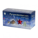 Blue box labeled “Pyramidenkerzen” with an illustration of a snowy cabin, a Christmas tree, and red star; contains 50 white candles.
