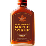 A 6.8 oz glass bottle of Maple Syrup - Pure Vermont Maple Syrup Farmer's Best, featuring a maple leaf logo and rich amber syrup inside.