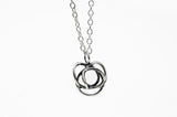The Flor Alida Floral Necklace in sterling silver features a 5/8" floral pendant on an 18" chain, shown against a plain white background.