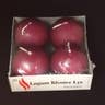 A package featuring four burgundy sphere candles made with natural wax for increased longevity.