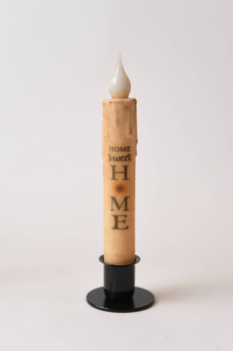 The Home Sweet Home Sunflower LED Timer Taper Candle: Top Dusted features a faux flame, vertical script, and sunflower design, blending charm and convenience—like the scent of cinnamon clove or the glow from a cozy candle holder.