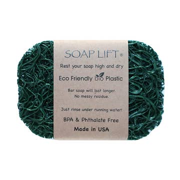 Green soap saver dish made of bioplastic with a brown label that reads BPA-free, phthalate-free, and Made in USA.