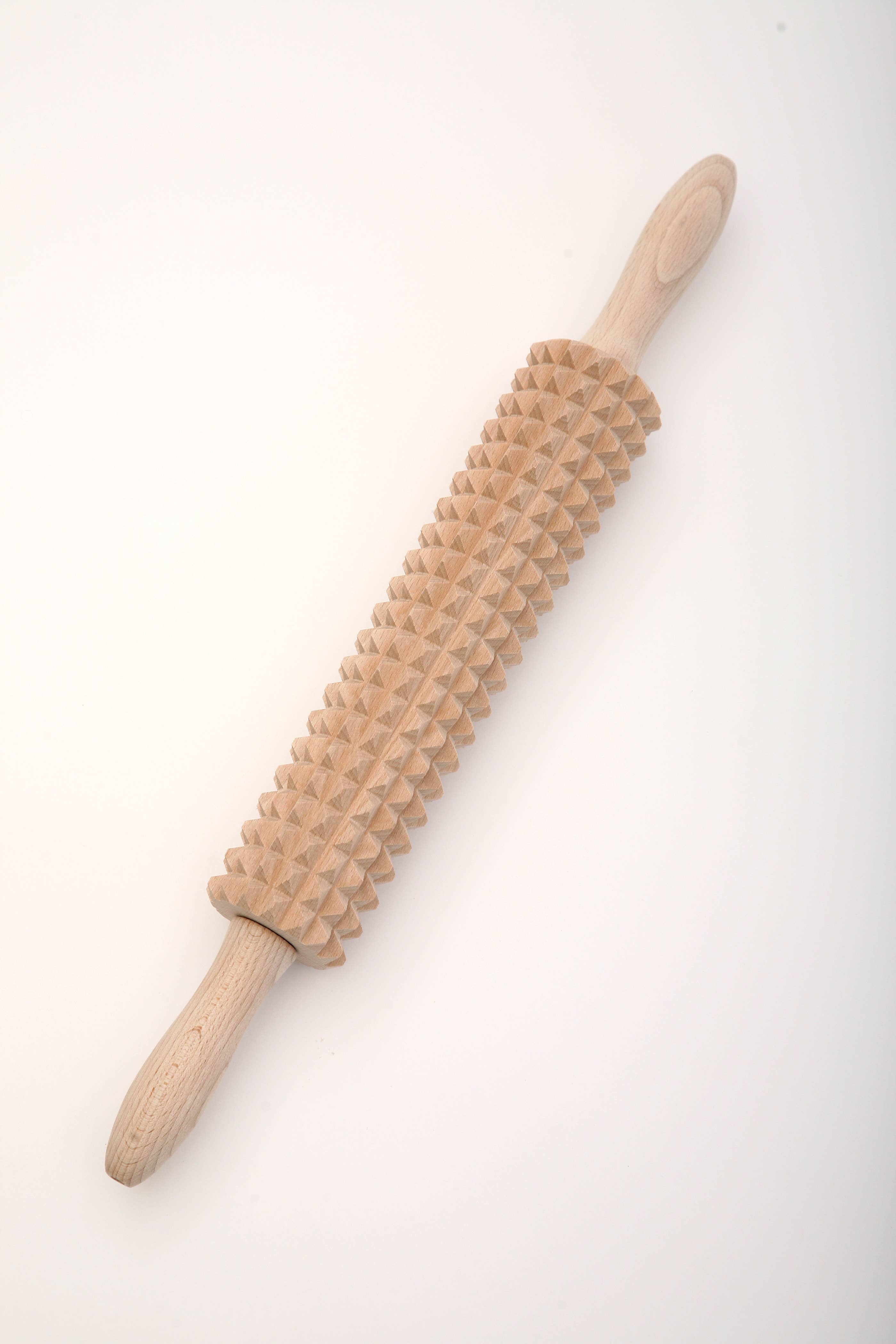 Displayed against a plain white background, the Rolling Pin: Deep Notched with Knakkebrod Recipe has a textured, spiked surface typical for crafting traditional Swedish Knakkebrod, embodying Linden Swedens craftsmanship.