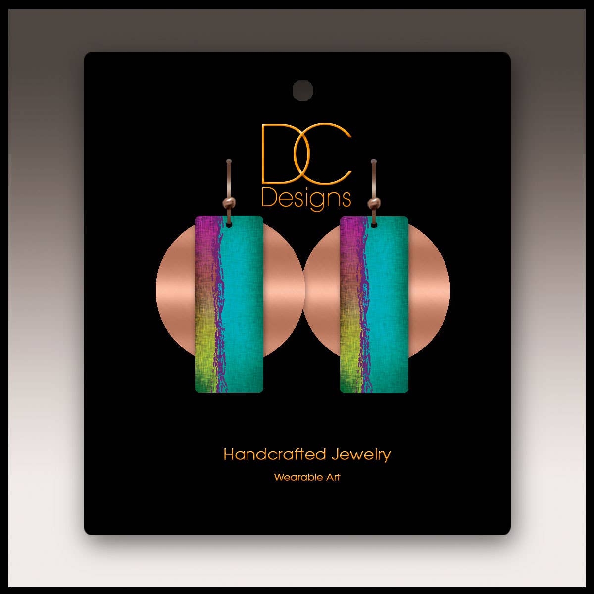 Earrings: Multicolor Copper Accent Multilayer Earrings—rectangular, handcrafted earrings in blue, purple, and green tones, showcased on a black DC Designs card labeled Handcrafted Jewelry, Wearable Art.