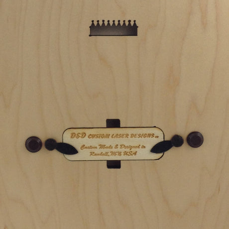 The Cribbage: Minnesota Phrases Cribbage Board features a premium maple wood surface, a crown-shaped cutout, and a plaque engraved with D&D Custom Laser Designs – Custom Made in Randall, MN. Ideal for fans of fine Minnesota phrases and craftsmanship.