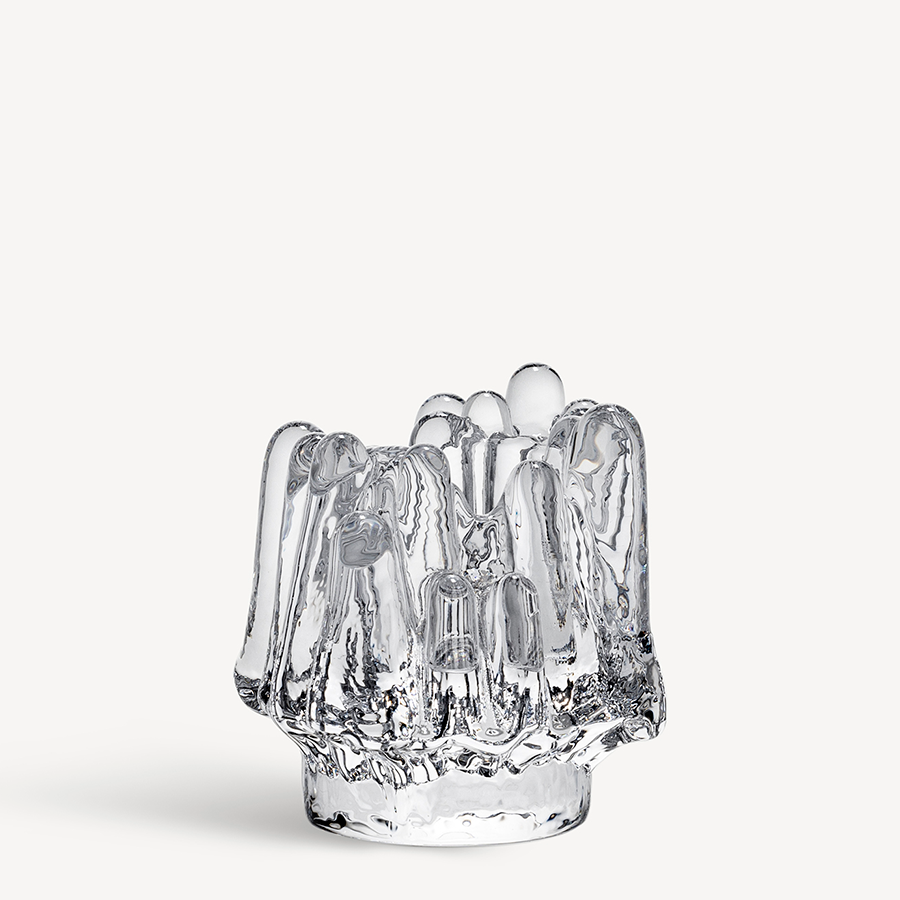 KostaBoda: Polar Votive Clear Medium (112mm x 108mm), a clear glass vase with an irregular, sculptural form inspired by Kosta Boda glass art, resembling melting ice or crystal, shown against a plain white background.