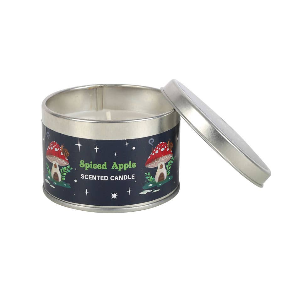 An open tin of the Gnome Sweet Gnome scented candle showcases a charming mushroom design on the label, making it perfect for your winter home decor.