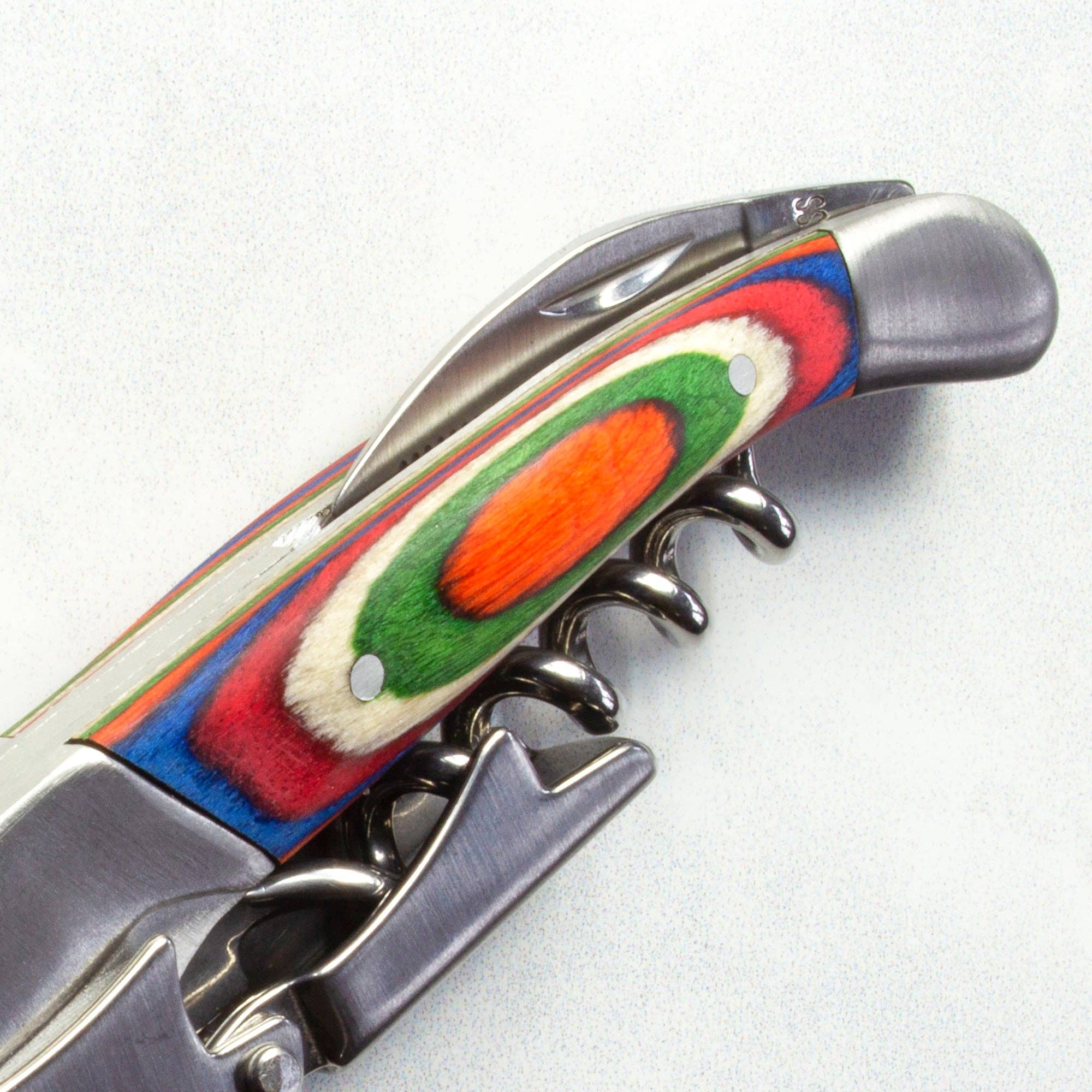 Close-up of a striking Waiter's Friend from the Marrakesh Collection, showcasing a metal body with a handle adorned in a lively multi-colored design.