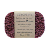 The Original Soap Lift Soap Saver by Faire – Soap Lift is a maroon, oval, mesh-textured eco-friendly soap holder with a brown paper label. Made in the USA from BPA- and phthalate-free bio plastic, it keeps your bar high and dry. Multiple colors available.