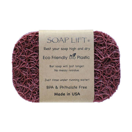 The Original Soap Lift Soap Saver by Faire – Soap Lift is a maroon, oval, mesh-textured eco-friendly soap holder with a brown paper label. Made in the USA from BPA- and phthalate-free bio plastic, it keeps your bar high and dry. Multiple colors available.
