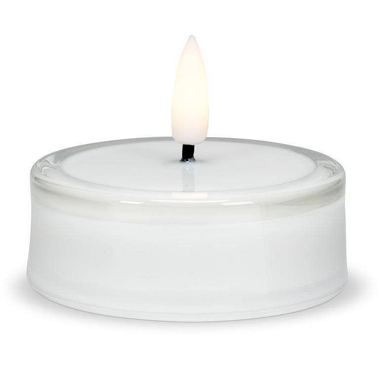 Flameless LED tea light candle inside a round glass holder.