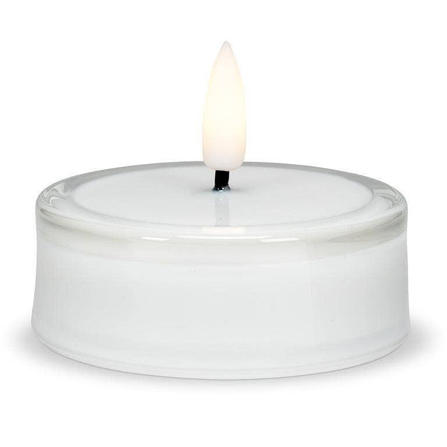 Flameless LED tea light candle inside a round glass holder.