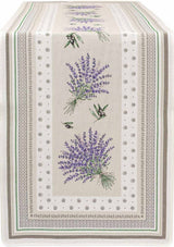Rectangular beige table runner with green borders and decorative lavender and olive motifs along the edges.