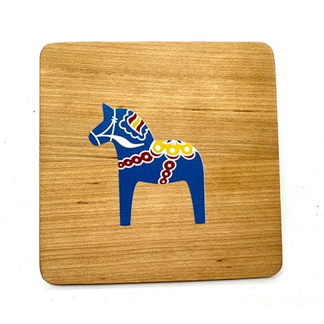 The 4" square alder wood coaster showcases a blue Dala Horse with colorful kurbits, inspired by traditional Swedish design.