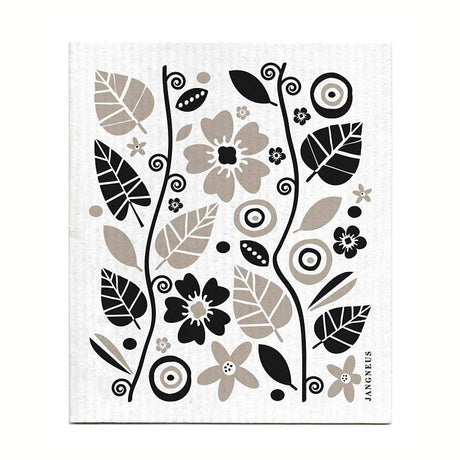 The Garden Black Gift Set includes a tea towel and dish cloth featuring black and beige floral and abstract designs on white, ideal for sustainable kitchen use.