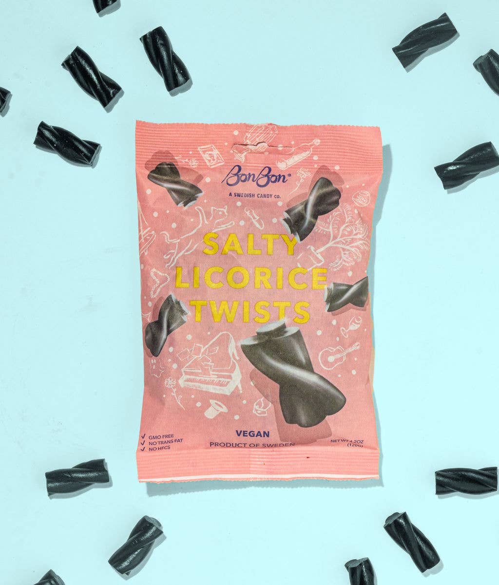 A 120g (4.2oz) bag of BonBon Salty Licorice Twists is displayed on a light blue surface, classic Swedish licorice candy surrounded by loose licorice pieces.