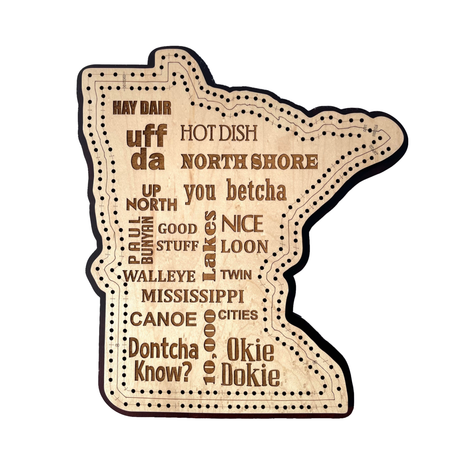 The Cribbage: Minnesota Phrases Cribbage Board is a premium maple wood cutout of Minnesota, engraved with local phrases like “uff da,” “you betcha,” and “walleye,” plus decorative dotted lines—perfect for display or games.