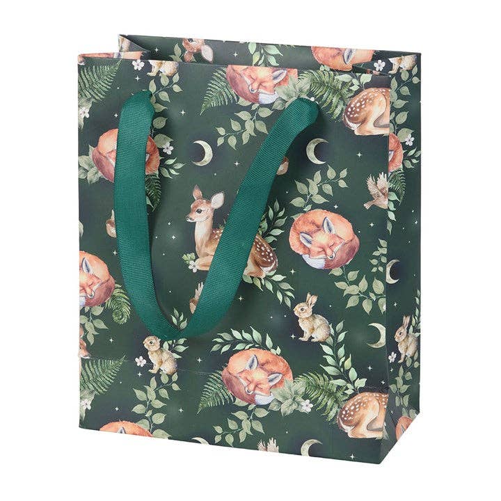 The Gift Bag: Fawn and Friends Forest Animal Print Medium Gift Bag features foxes, deer, rabbits, leaves, crescent moons, and is finished with green fabric handles.