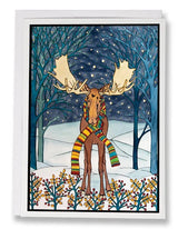 Card: Holiday Moose by Sarah Angst features a moose in a colorful striped scarf, standing in a snowy nighttime forest with falling snow and bare trees. This 5x7 greeting card comes with an envelope and is blank inside.