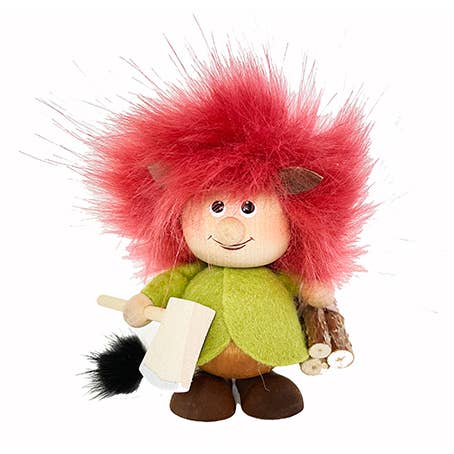 The Figurine: Troll with Ax and Firewood features a handcrafted troll with red fuzzy hair in a green outfit, holding an axe and pieces of wood, ideal for adding charm to Scandinavian decor.