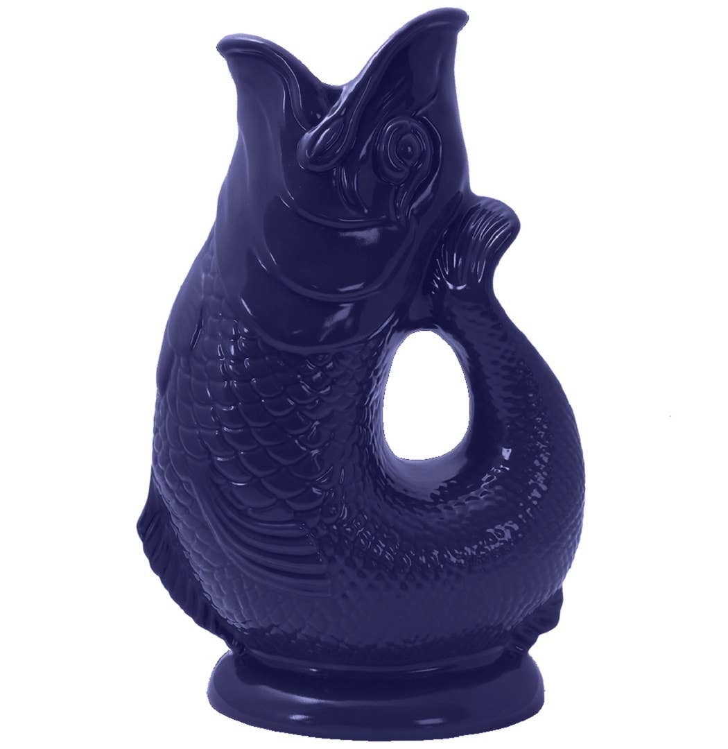 This Gluggle Jug in a stunning cobalt blue is an exquisite ceramic piece, intricately crafted in the shape of a fish with an extra large handle extending from its open mouth.