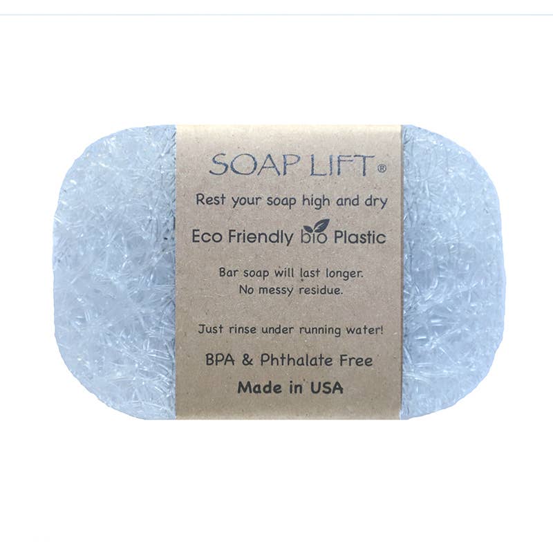 The Soap Lift: Crystal The Original Soap Lift Soap Saver - Crystal is made from clear, recyclable bio plastic and features a brown label that displays usage instructions and product benefits.