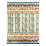 Patterned fabric with green floral stripes, blue borders, and orange accents in a repeating symmetrical Swedish motif.