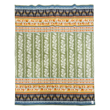 Lambswool blanket with green and white floral stripes, orange accents, and blue bands featuring white menorahs, in a Swedish-inspired design.
