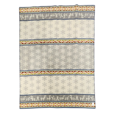 Wool blanket with Sámi-inspired rows of reindeer, snowflakes, and geometric patterns in gray, white, yellow, and red.