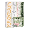 A folded blanket with green, yellow, gray, and pink geometric and floral patterns, plus a small OEKO-TEX certified square displaying matching designs on the edge.