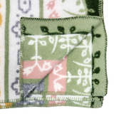 Fleece blanket with green, white, pink, and yellow patterns, folded to display both patterned sides and decorative edge stitching.