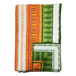 Folded blanket with orange, yellow, green, and white geometric patterns, zigzag designs, and decorative stitched border in Scandinavian style.