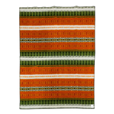 Rectangular lambswool blanket displaying orange, green, and white horizontal stripes with all-over intricate geometric patterns.