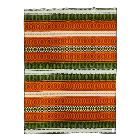 Rectangular lambswool blanket displaying orange, green, and white horizontal stripes with all-over intricate geometric patterns.