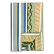 Folded fleece blanket in a Swedish design featuring green, blue, and cream stripes with wavy patterns; one corner is turned over to display the reverse side.