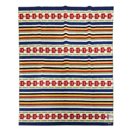 Wool blanket with horizontal stripes in navy, yellow, red, and white, and red geometric patterns. Scandinavian design details are visible.