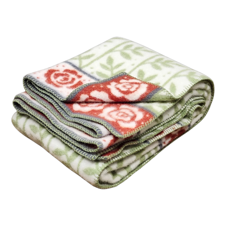 Swedish design blanket with green leaf pattern, red rose-bordered edging, and green and white stitched trim.