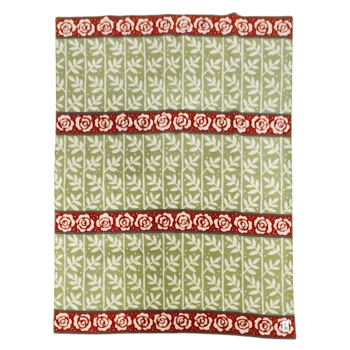 Green blanket with a white leaf pattern and three horizontal red bands, each featuring a row of white roses. Swedish design elements are visible.
