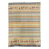 Rectangular lambswool blanket with horizontal orange, black, and beige stripes, showing Swedish folk art-inspired geometric and floral patterns.