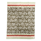 Rectangular lambswool blanket with a brown floral pattern and red and green decorative stripes along the top and bottom edges.